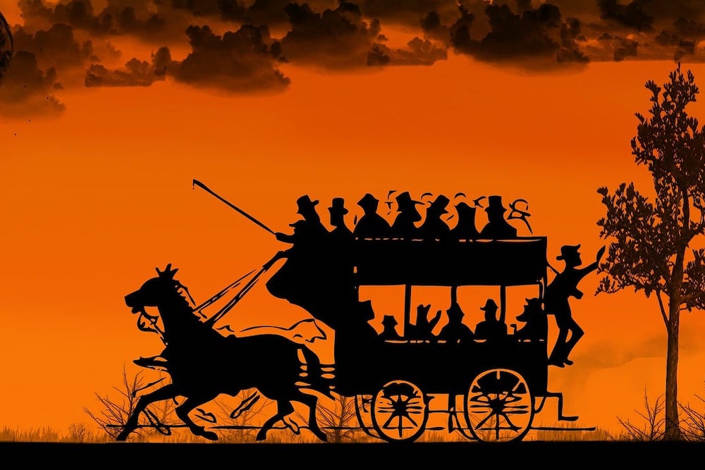 Illustration d'un ancien véhicule tracté par des chevaux et transportant de nombreux passagers